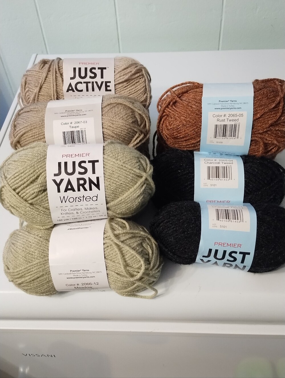 Premier Just Yarn Worsted in Taupe, Meadow, Rust Tweed, and Charcoal Tweed